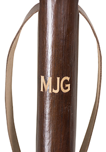 walking stick branded with initials